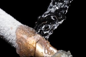 A pipe leaking with freeze damage